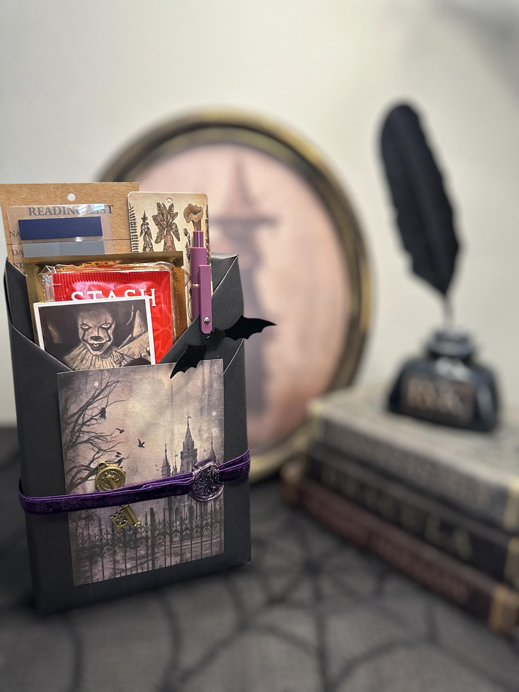 a batman themed gift bag sitting on top of a table