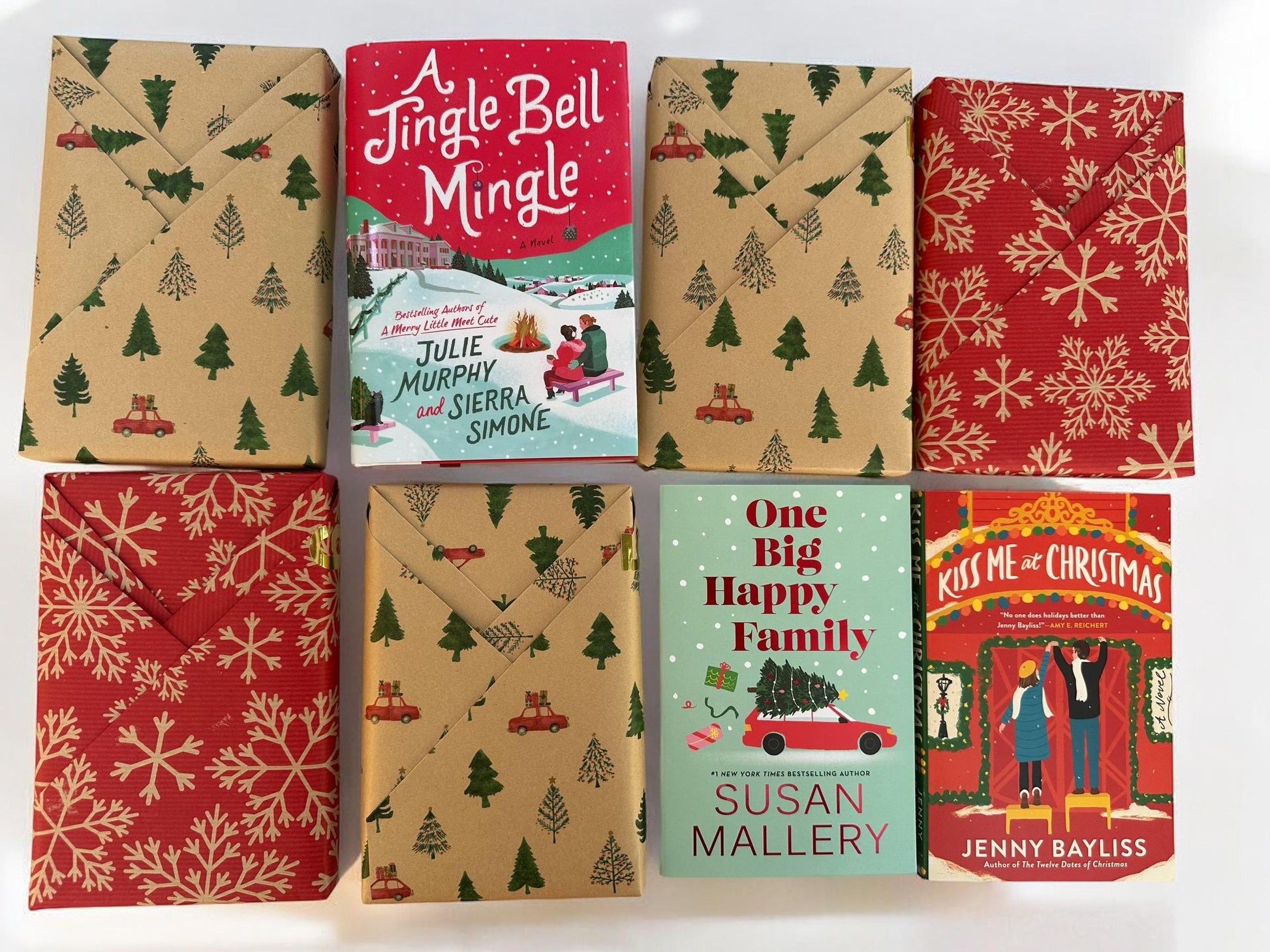 a group of christmas books sitting on top of each other