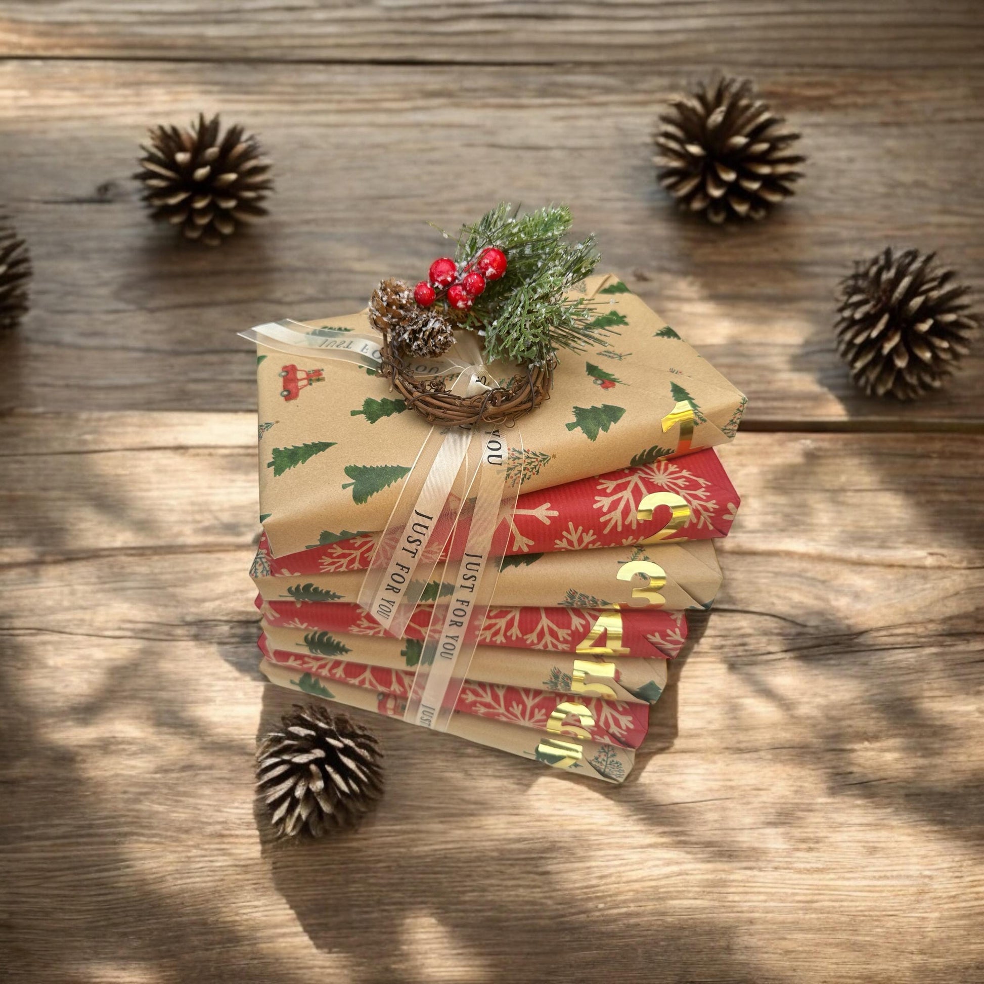 a stack of wrapped presents sitting on top of a wooden table