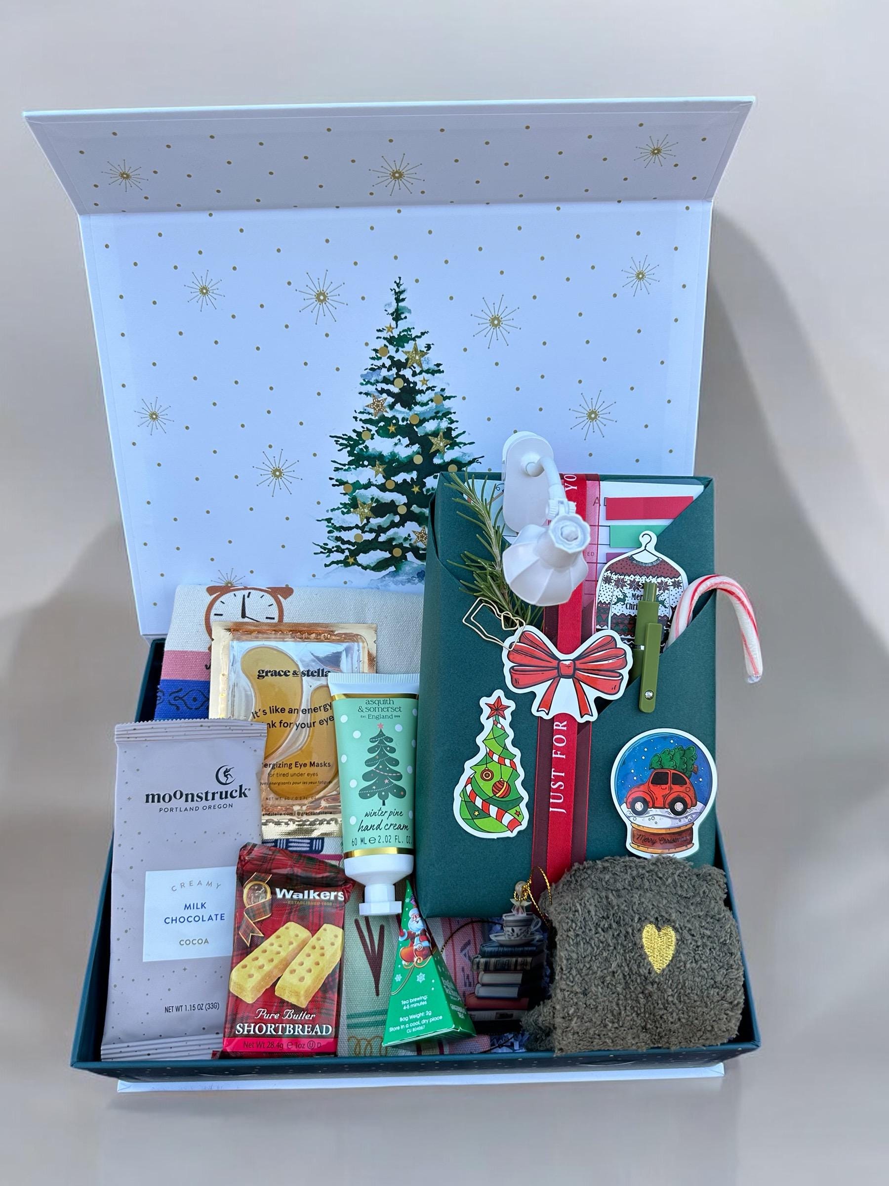 a christmas gift box filled with various items
